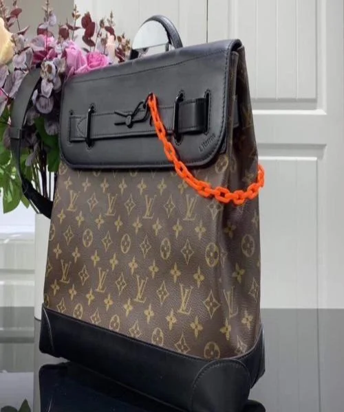 Louis Vuitton backpacks with a padded laptop compartment for travelLouis Vuitton Steamer PM Taiga Leather Monogram Brown