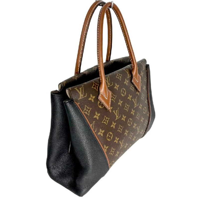 Louis Vuitton bags with a chain - link trim and a leather body for a modern edgeLouis Vuitton Monogram W Tote MM