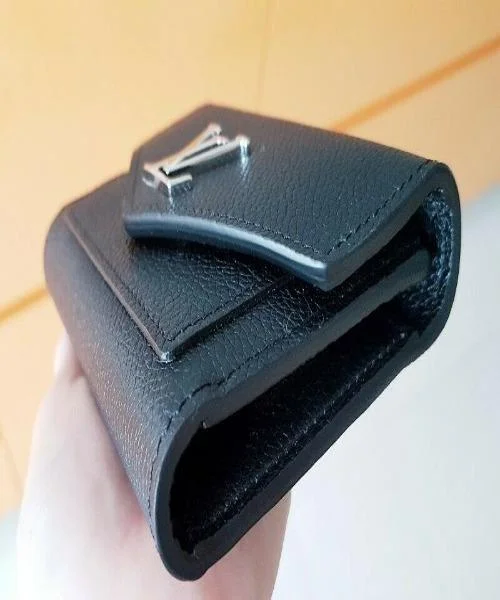 Louis Vuitton Alma bags with a monogram - embossed leather surfaceLouis Vuitton MyLockMe Compact Wallet Noir