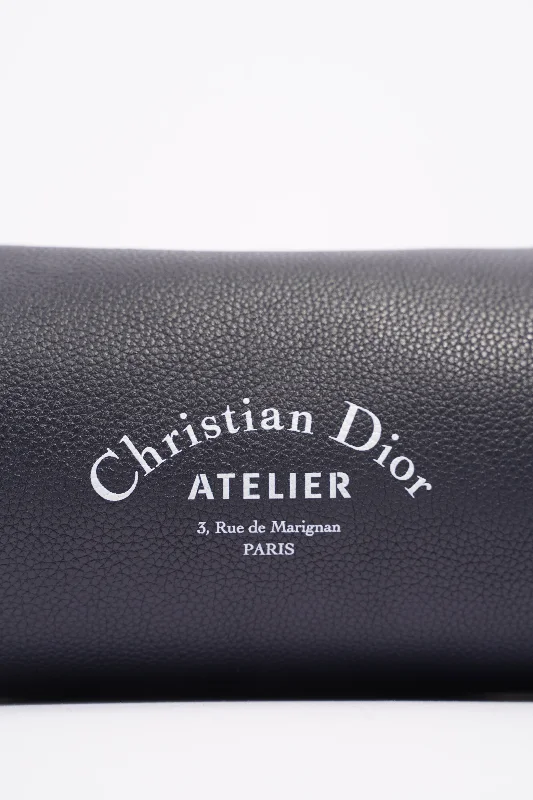 Christian Dior tote bags with a printed Dior logo on the frontChristian Dior Mens Roller Messenger Bag Navy