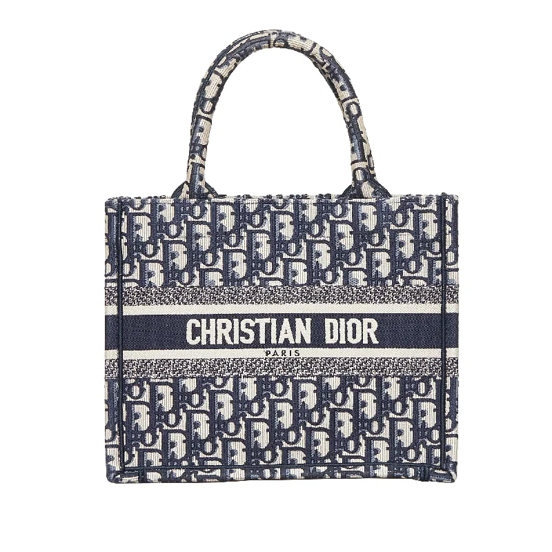 Christian Dior Saddle bags with a studded trim for a bold lookDior Book Tote Small Blue Oblique Canvas