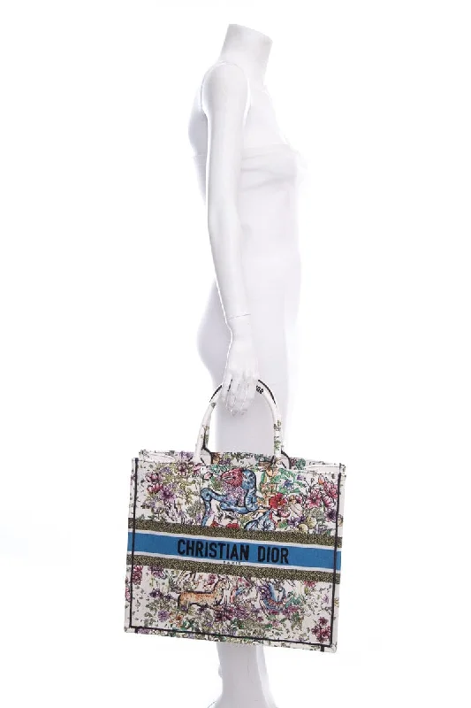 Christian Dior Saddle bags with a patent leather finish for a shiny lookDior White Floral Woodland Embroidered Book Tote HandBag