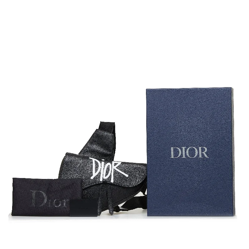 Christian Dior Saddle bags with a studded trim for a bold lookDior X Stussy Saddle Bag Black Calfskin Limited Edition